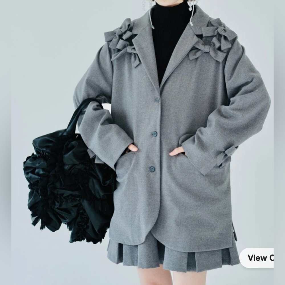 Lapel neck bow front single breasted blazer and pleated skirt set